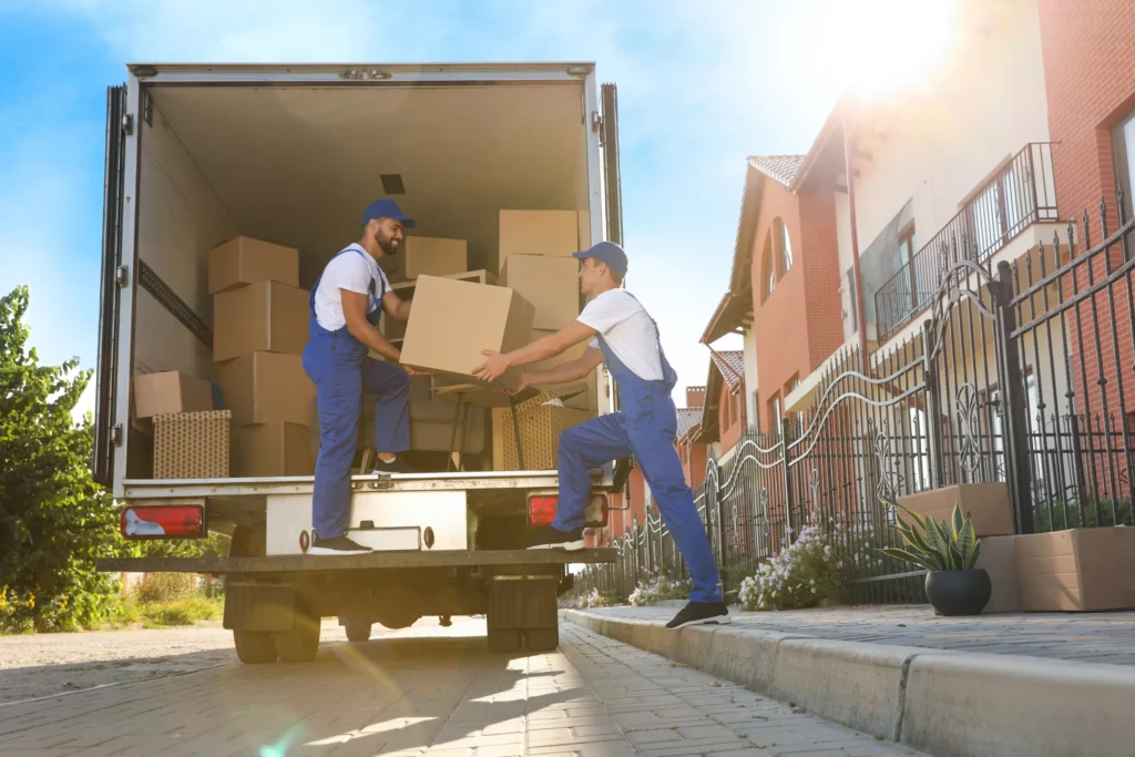 starting a box truck business: men loading a truck
