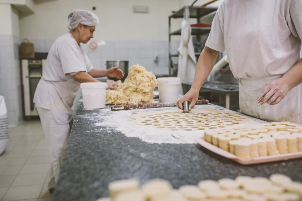bakers creating baked goods for their bakery business